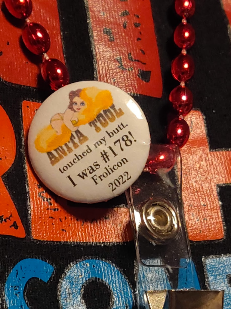 A button attached to a Frolicon nametag that reads: "Anita Tool touched my butt. I was #178! Frolicon 2022"