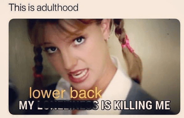 An image of Britney Spears from the "Baby One More Time" video, subtitled "My lower back is killing me," with the caption "this is adulthood".