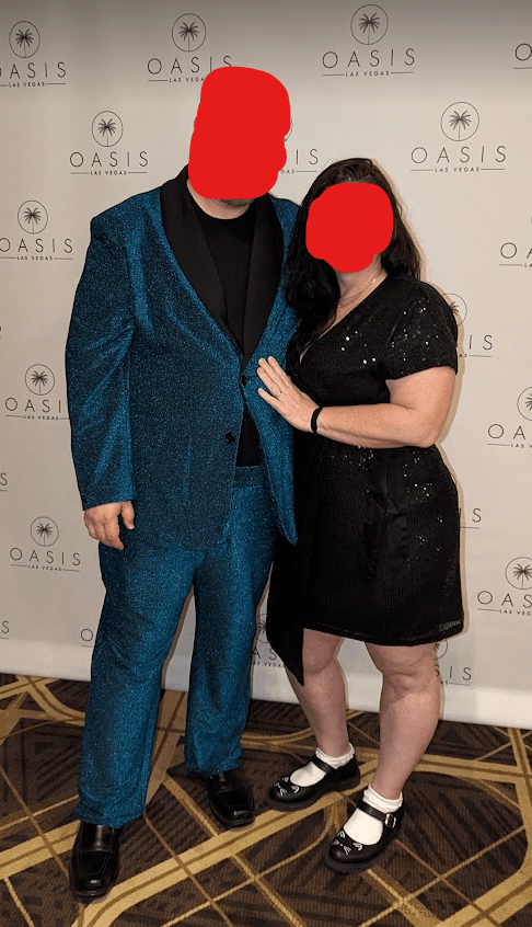 A photo of Partner 1 and myself, dressed up for the Saturday night banquet, with our faces obscured.