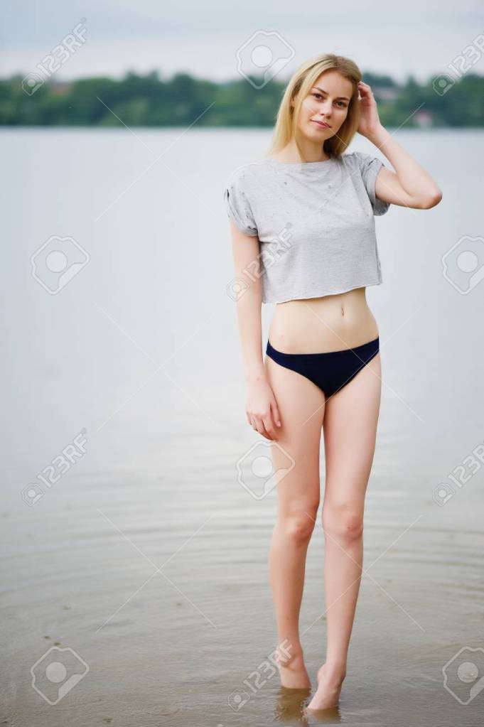 A blonde in a t-shirt and panties.
