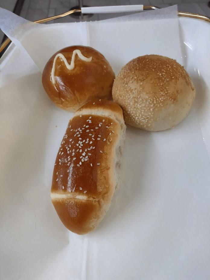 Three buns from an Asian bakery arranged in a penis-and-balls shape.